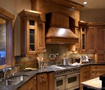 Rustic Kitchen Design With Pro Viking Range, Large Wood Hood, And